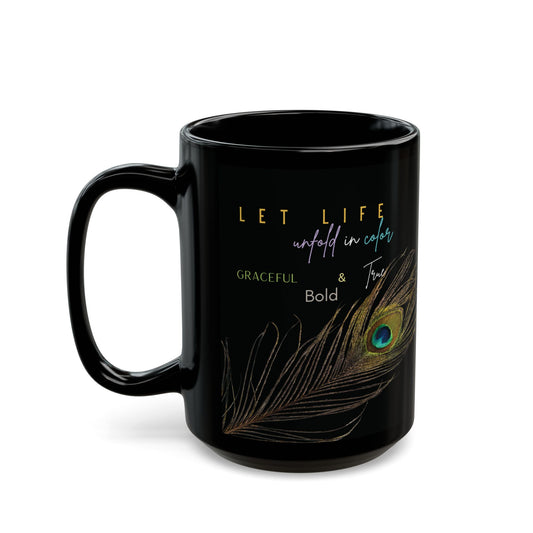 Black mug with peacock feather design and motivational quote on a white background