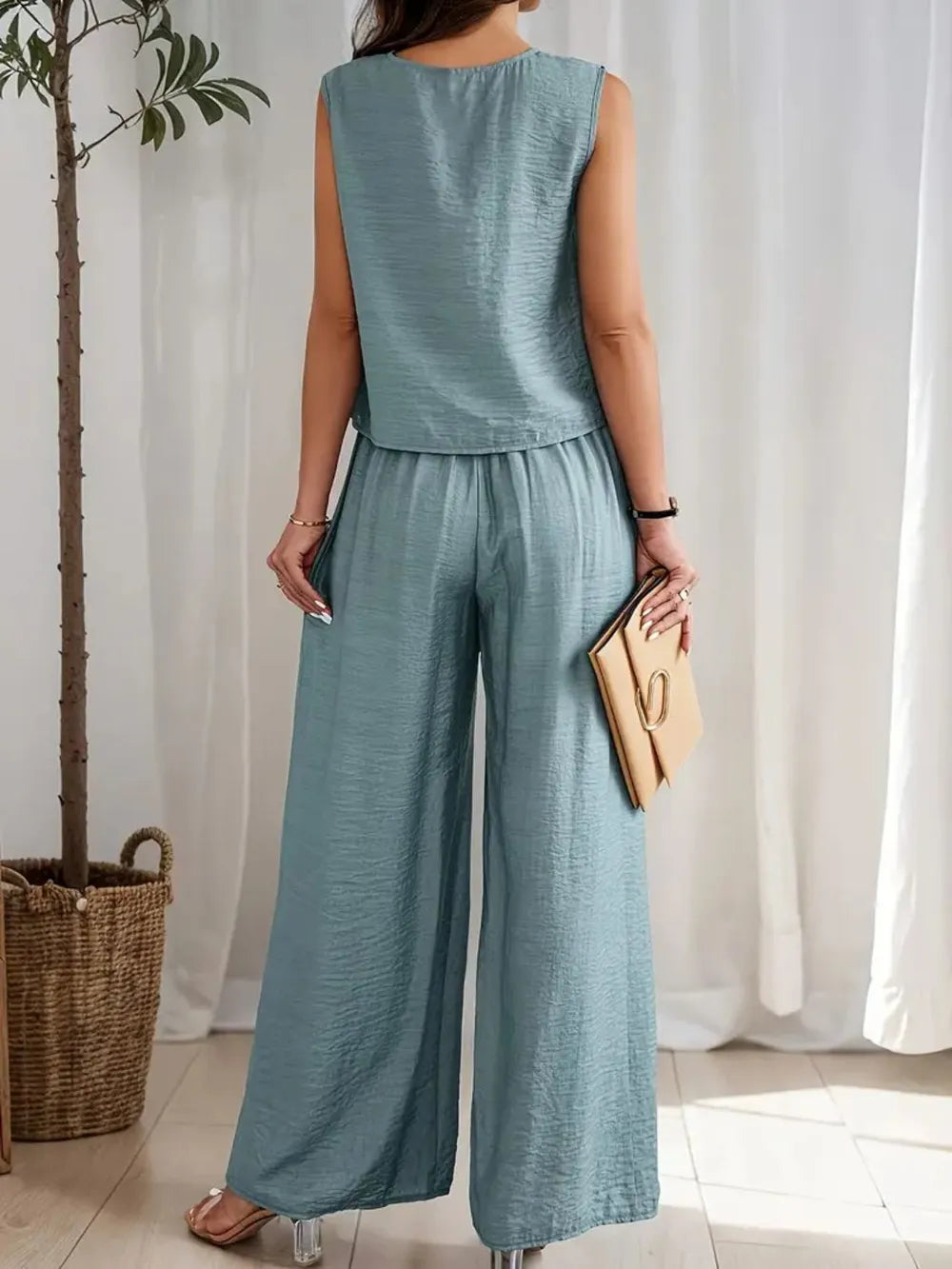 Back view of no-stretch two-piece outfit with flowy pants and sleeveless top