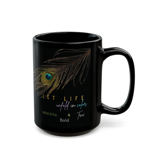 Black mug with peacock feather design and motivational quote on a white background