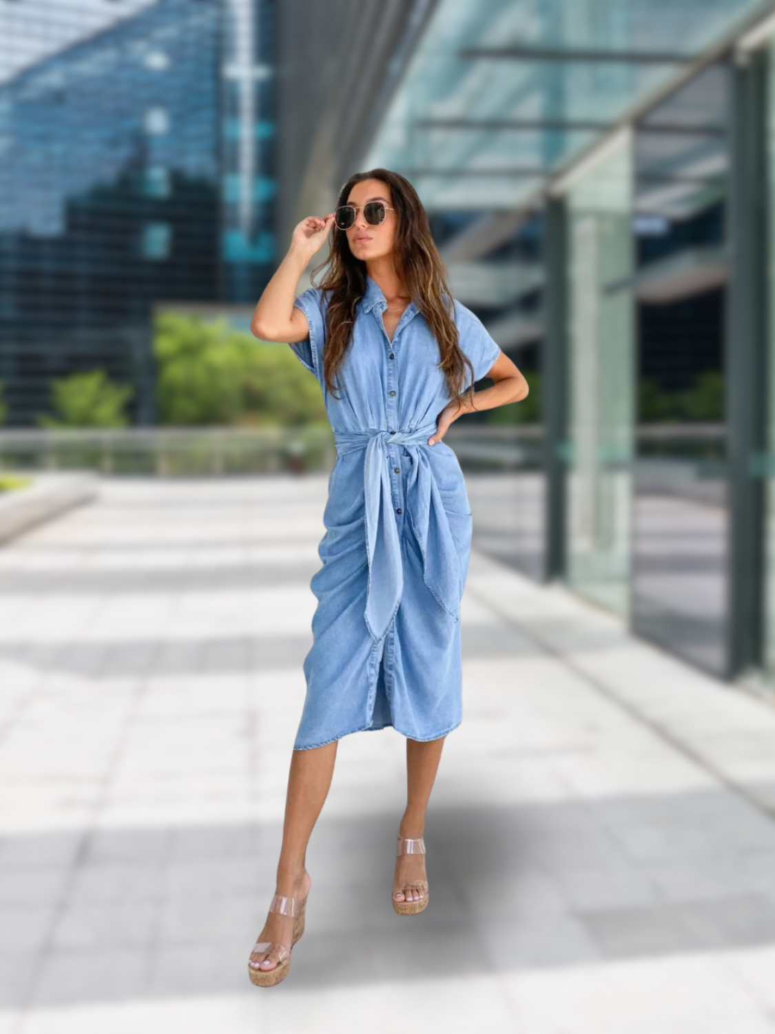 Front view of short sleeve denim dress with belted waist and button-down design