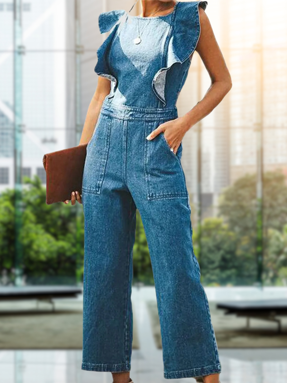 Backless ruffled denim jumpsuit with sleeveless design and structured fit