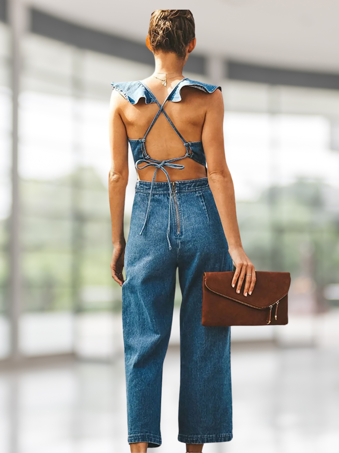 Close-up of ruffled details on backless sleeveless denim jumpsuit