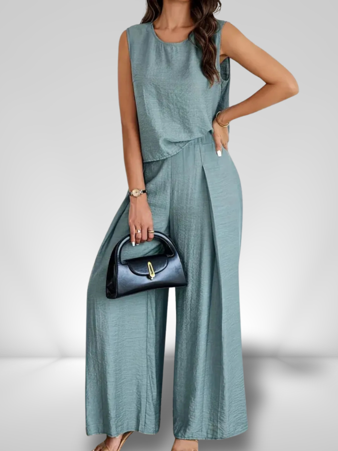 Woman wearing a sleeveless ruched top and wide leg pants two-piece set